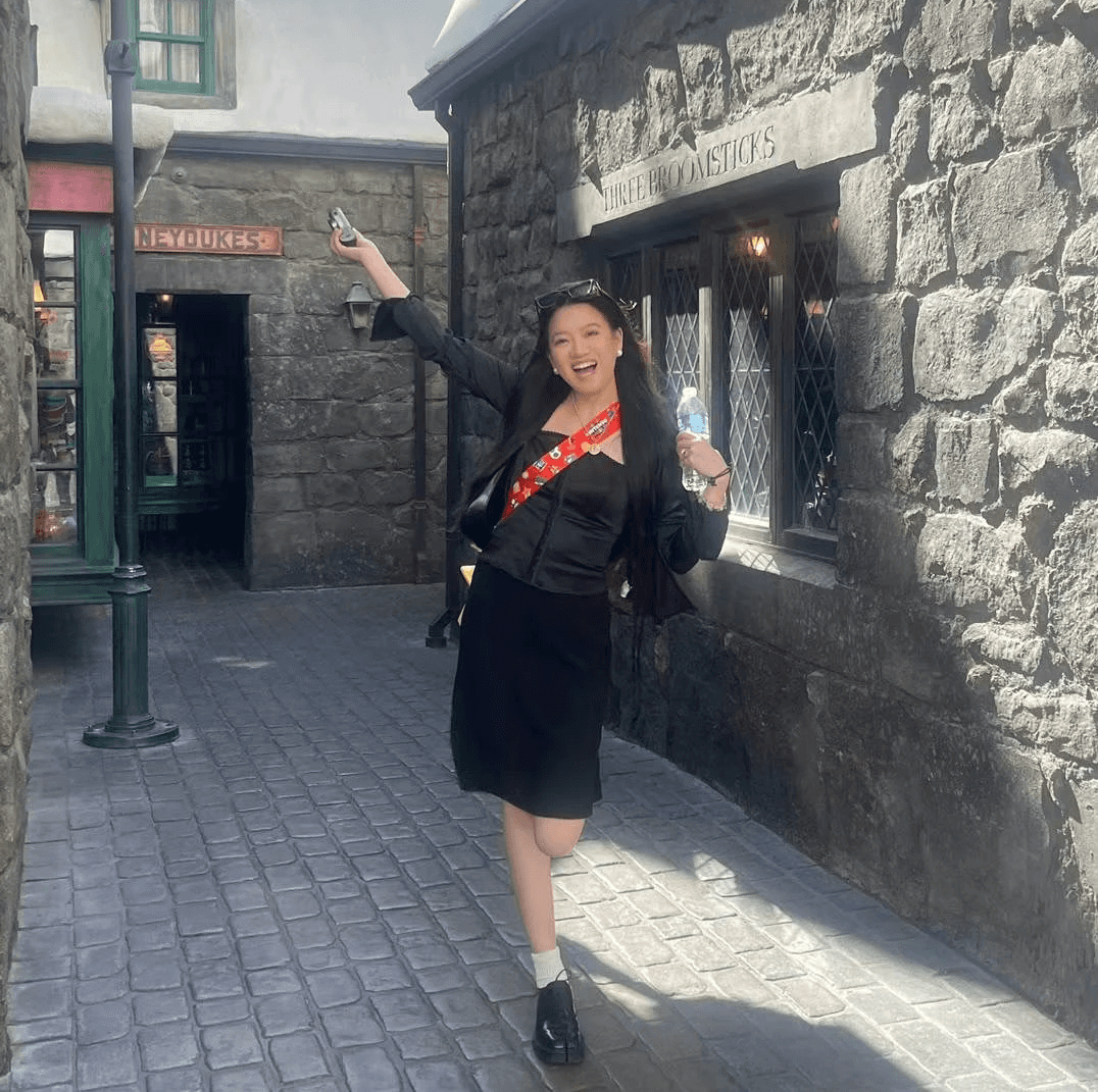 Rebecca posing on a cobblestone street
